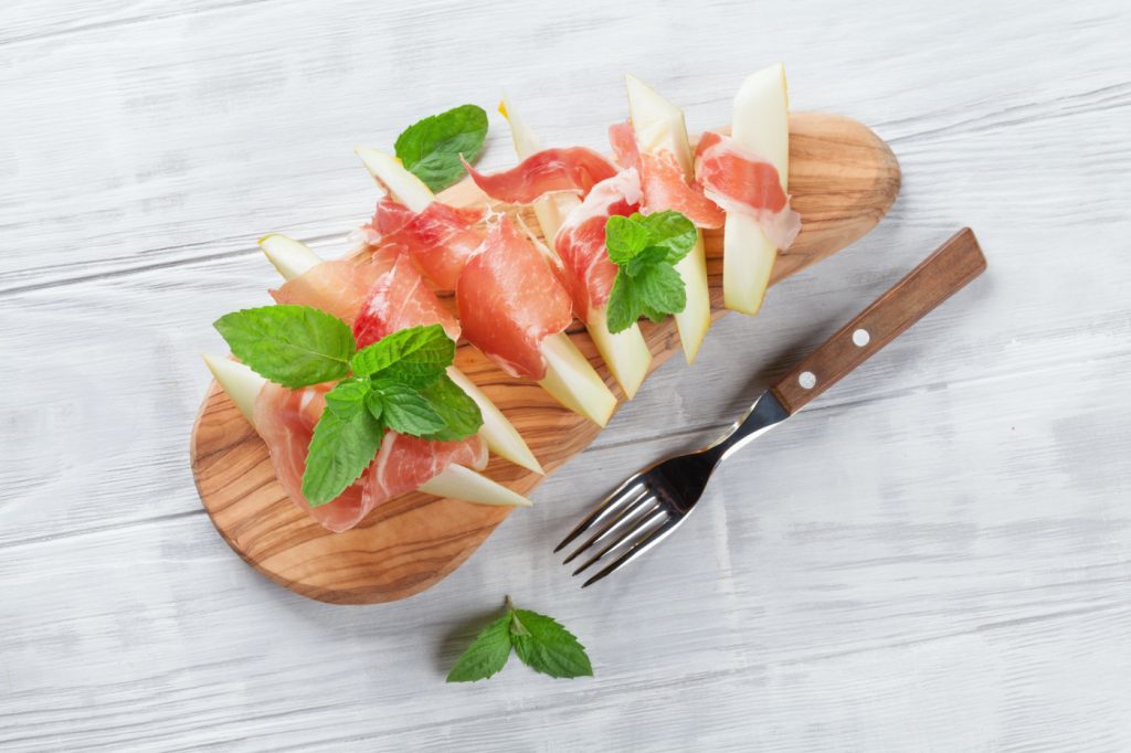 Fresh melon with prosciutto and mint